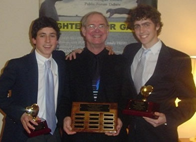 Public Forum Champions Chris Comenos (left) and Jeff Gang (right) with Coach Tim Averill